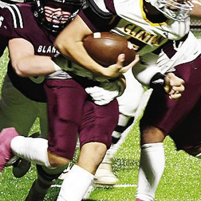 No. 7 Easten Powell fights through a Blanchard player as he takes the ball up the field after intercepting it last Friday during Clinton’s playoff win against the Lions in Blanchard. CDN | John Kinsey Clinton dethrones state champs