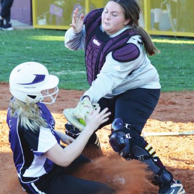 Clinton sophomore catcher Blair Hunter applies the tag for an out at home plate. Hunter put together one of the best all-around games, going 3-for-5 at the plate with two RBIs and zero errors in the field. CDN | Collin Wieder Lady Reds drop slugfest to H-E