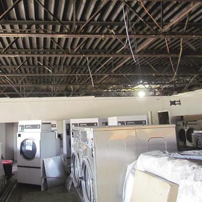 The ceiling stands uncovered and awaits rewiring at the Wash House. CDN | Christian Jacobsen