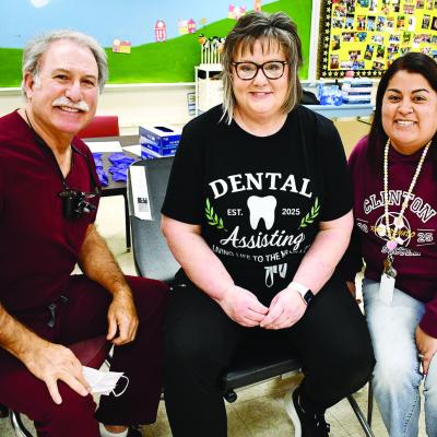 Brenda Martinez, a WTC dental assisting graduate (2007) and now second-grade teacher at Southwest Elementary School, at right, met up with her former instructor, Kelly Pease, middle, and the dentist she worked with for 15 years, Dr. Floyd Simon Jr., durin