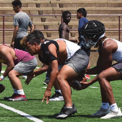 Clinton football players praticing spring football are, front from left, Asley Sumagans, Matt Nguyen and Javion Hill. In back are Kyler Ringo Kabunda, Martin Marquis and Samuel Velez. Red Tornadoes conclude spring football