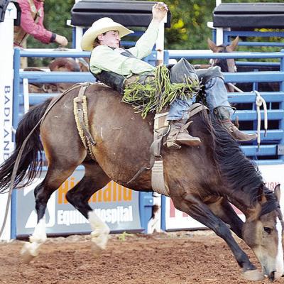 Pauls Valley’s Austin Stratman holds on in the bareback riding event of the rodeo Saturday in the Clinton Round-up Club Arena. CDN | Sam Goodwyn