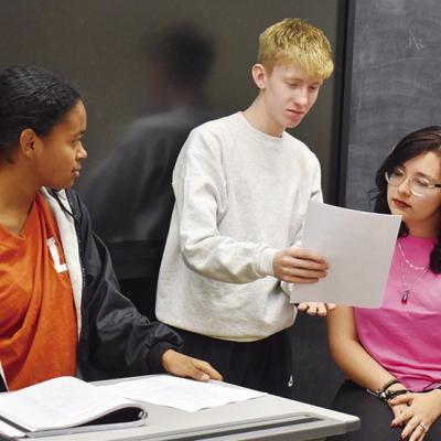 Attorneys Emory McClain and Ryder Adams, at right, go over the direct and cross examination of their shared witness portrayed by Mya Elizondo in Ashley Kelley’s room at Clinton High School. CDN | Caleb Blanchard Clinton High School legal team preps to start season