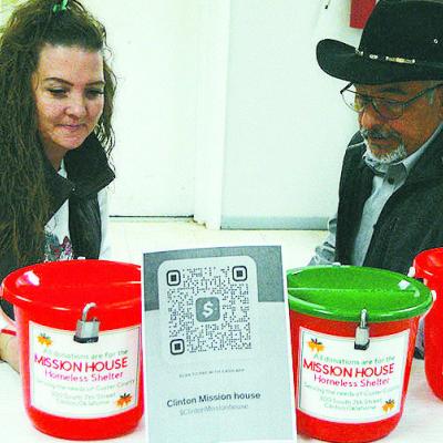 Jennifer Lee, left, and Adolph Elizondo go over plans for the Mission House’s holiday fundraiser. CDN | Hope King Jennifer Lee, left, and Adolph Elizondo go over plans for the Mission House’s holiday fundraiser. CDN | Hope King