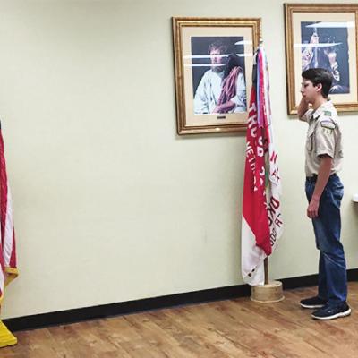 Boy Scouts honor flag in ceremony
