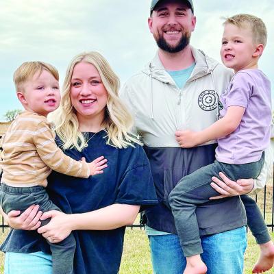 Tori Christian and her husband Garrett hold their sons Levi, left, and Landry. CDN | Courtesy photo