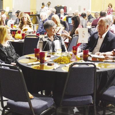 Prior to induction of the 2024 class for the Clinton Athletics Hall of Fame, Randy Meacham, second from right, talks with everyone at his table. Pictured from left, are Denny Meacham, Patricia Meacham, Sharon Meacham, Randy Meacham and Bill Mandrell. CDN Discussing over dinner