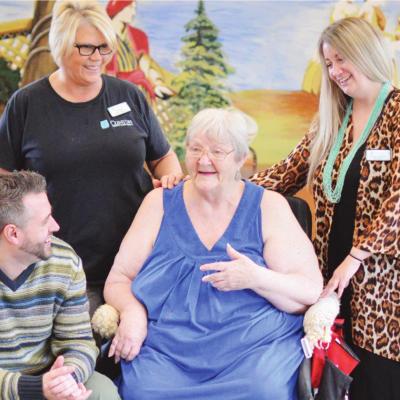 At Clinton TLC, front row from left, are owner Brandon Morgan and resident Mary Lou Garrett; and back row, activities director Sheri Shaw and administrator Kendra Steinly. Clinton TLC makes