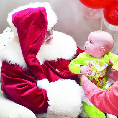 Tripp Mandrell meets Santa Claus at the Pepsi Event Center during the Clinton Festival of Lights. CDN | Micah Ashcraft