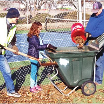 Ken Baker, left, Arapaho student Audrey Kauk, and Mark Nicholson clean up the areas around the tennis courts at Clinton High School. CDN | Robert S. Bryan Clintonites urged to pull togeth