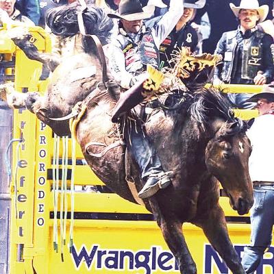 Arapaho’s Wacey Schalla holds on tight to a bronco during a recent rodeo event. CDN | Courtesy photo