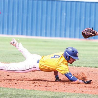 Arapaho-Butler’s Wyatt Waldrop dives back to second base during the Indians’ 17-1 rout of Ringwood in opening round action of the district tournament Thursday. CDN | Adam Ewing No. 11 Indians cruise on day one of district tournament