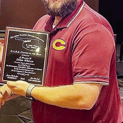 Clinton Police Department School Resource Officer Dillon Whitten accepts the D.A.R.E. Officer of the Year Award. CDN | Courtesy photo