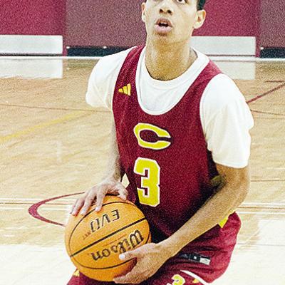 No. 3 Titan Malone aims the ball at the hoop during basketball practice. CDN | Sam Goodwyn