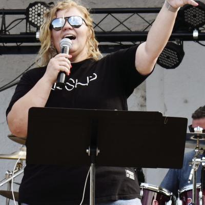 Lead vocalist of Cornerstone Worship, Merlanda Dorman, sings at the non-denominational worship concert at McLain Rogers Amphitheater last Friday. CDN | Nydia Campbell Praise in the park