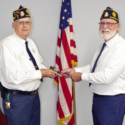 Former American Legion Post 41 Commander Donald Miller, left, presents the gavel to Keith Brisco to serve as commander for the chapter. CDN | Courtesy photo