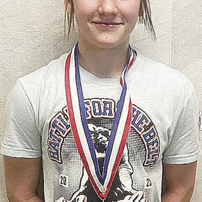 Clinton’s Kalley Fuller smiles after she finished fourth at the Junior High State Wrestling last week at the OG&amp;E Coliseum in Oklahoma City. CDN | Courtesy Photo