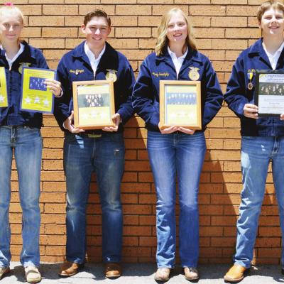 Holding just a few of the awards won from past years are Clinton High School FFA members, from left, Myra Whitney and Tony Morgan, juniors; Mindy Sawatzky, sophomore; and Eli Whitney, freshman. CDN I Collin Wieder FFA