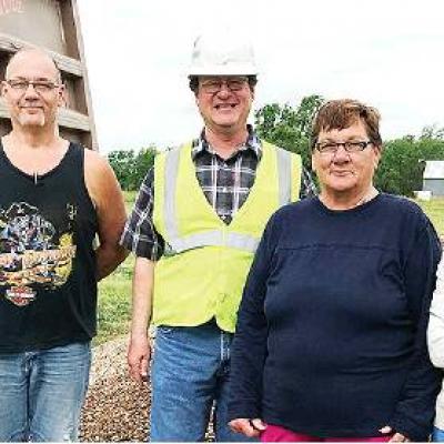 Community members came together recently to improve the play yard at Friends For Life animal shelter. Pictured, from left, are Ricky Roush, Dolese Area Supervisor Joe Howell, and FFL volunteers Joan Gould and CDN | Courtesy Photo