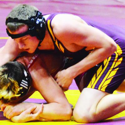 Clinton senior Brit Graves, top, controls his opponent in a home match last year. A broken wrist kept him out the majority of this season. CDN | Staff photo Senior hampered by injury majority of season