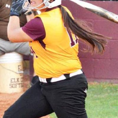 CDN | Collin Wieder Clinton senior Julie Seabolt hits a ball into play in the Lady Reds’ 5-3 win over Elk City. Seabolt powers CHS deep ball offensive attack