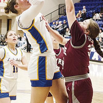 Arapaho-Butler’s Peyton Lambeth shoots the jumper over a Hammon defender while No. 11 Alivia Casas waits to help out in the Lady Indians’ win over Hammon in the first round of the Western Equipment Classic. CDN | Sam Goodwyn