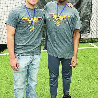 Sutton Hernandez, left, and Bryson Miles smile after competing at the Area Special Olympics Unified Bocce Ball Tournament at Clinton High School. CDN |Courtesy Photo