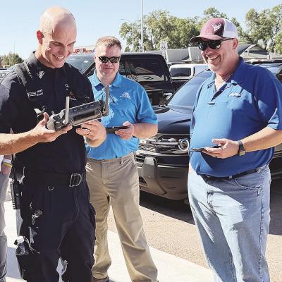 Lt. Tyler Calvert shows off the capabilities of the Clinton Fire Department’s drone to Tim Miller and Billy Goodwin at a recent Noon Lions meeting. CDN | Shiann Dawson