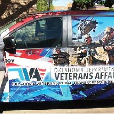 CDN | Robert S. Bryan Steve Roblez, rural transportation services program administrator for the Oklahoma Department of Veterans Affairs, with ODVA van driver Belinda King. Article Image Alt Text