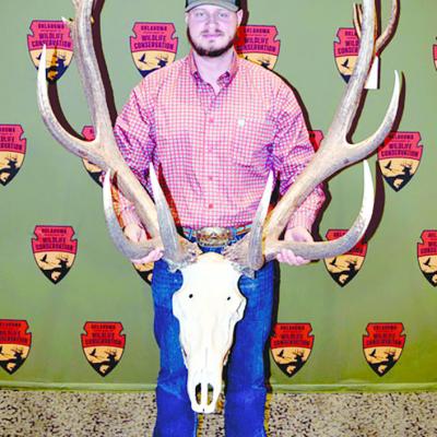 Zane Scrivner holds the antlers of the elk he took in September at Fort Sill. It is Oklahoma’s new record nontypical elk with a score of 411 1/8. CDN | Courtesy photo