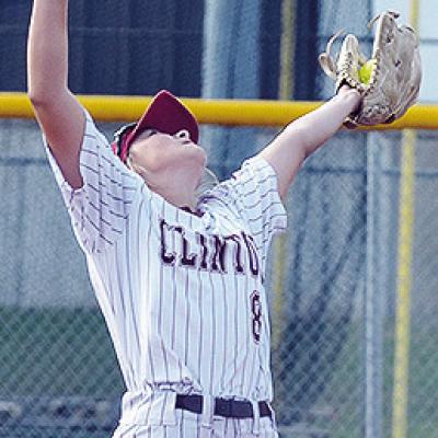 No. 8 Hadley Meget stretches out to capture the ball in her glove for the out during Clinton’s game against Elk City. CDN | Sam Goodwyn No. 8 Hadley Meget stretches out to capture the ball in her glove for the out during Clinton’s game against Elk City. CDN | Sam Goodwyn