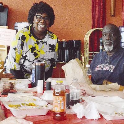 From left, Shelly Ramey, Gwen Bagby, H.O.S.T. Ministries Pastor Wilma Jackson, Lindell Brown, and Ethel Isbell break bread together during the recent H.O.S.T. Ministries community Christmas meal. From left, Shelly Ramey, Gwen Bagby, H.O.S.T. Ministries Pastor Wilma Jackson, Lindell Brown, and Ethel Isbell break bread together during the recent H.O.S.T. Ministries community Christmas meal.