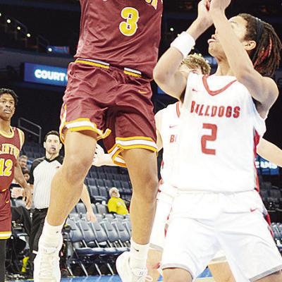 Clinton’s Titan Malone shoots a jump shot against a Cache defender during the Reds’ game Wednesday against the Bulldogs in the Paycom Center. CDN | Sam Goodwyn Clinton’s Titan Malone shoots a jump shot against a Cache defender during the Reds’ game Wednesday against the Bulldogs in the Paycom Center. CDN | Sam Goodwyn