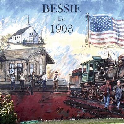 This mural on the north side of the school building on Main Street shows the history of Bessie. Bessie townsite moved two times because of railroad