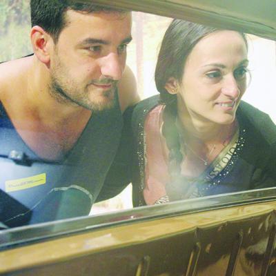 Andrea Vertucci and Marina Maifilo from Milan, Italy, examine a vintage car at the Oklahoma Route 66 Museum in Clinton during their holiday tour. CDN | Elisha Rangel Touring museum
