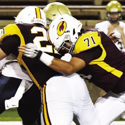 Clinton’s No. 71 Larynz Spottedwolf helps his teammate, Cooper Whitetail, take down the Kingfisher ball carrier in the Red Tornadoes’ contest against the Yellowjackets this season in the Tornado Bowl. CDN | John Kinsey Senior Clinton football player eyes future in oil
