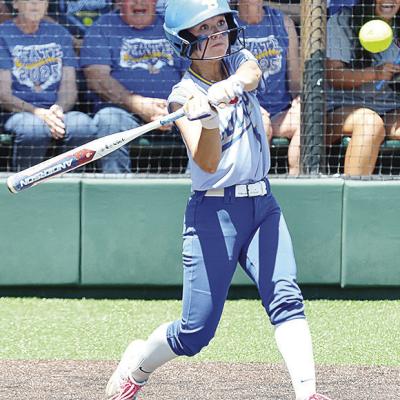 Arapaho-Butler’s Reagan Schoeppach stares down the ball as she prepares to hit it during the Lady Indians’ Class 3A State Softball Tournament game Monday against Dewar. CDN | Sam Goodwyn Arapaho-Butler’s Reagan Schoeppach stares down the ball as she prepares to hit it during the Lady Indians’ Class 3A State Softball Tournament game Monday against Dewar. CDN | Sam Goodwyn
