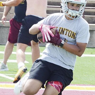 Clinton’s Jaden Potter catches the ball and turns up field during a spring practice in the Tornado Bowl. CDN | Sam Goodwyn