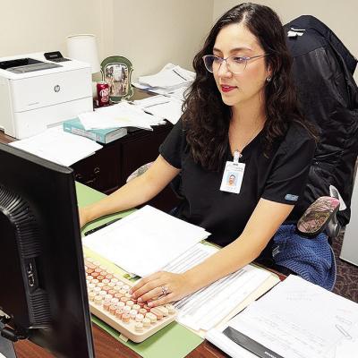 Stefanie Bustos works on checking financials for Clinton Regional Hospital. CDN | Shiann Dawson Stefanie Bustos works on checking financials for Clinton Regional Hospital. CDN | Shiann Dawson