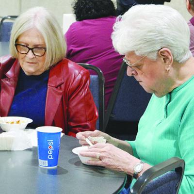 Carolyn Riley, left, and Carol Bentley sample the offerings of the annual Rotary Chili Day last week. CDN | Hope King