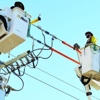 Journeyman lineman Noah Morhiser works on a power line on U.S. Highway 183. CDN | Michael Maresh Journeyman lineman Noah Morhiser works on a power line on U.S. Highway 183. CDN | Michael Maresh
