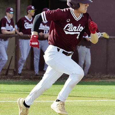 Clinton’s Chase Ray hustles to first during the Reds’ home game against Woodward. CDN | Sam Goodwyn Clinton’s Chase Ray hustles to first during the Reds’ home game against Woodward. CDN | Sam Goodwyn