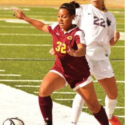 CDN | Collin Wieder Clinton senior Riley Bryson keeps possession of the ball against a Chickasha defender. Article Image Alt Text