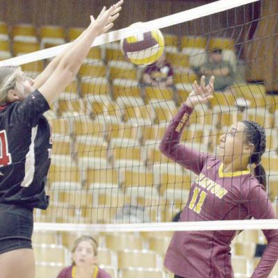 Ali Rodelo, right hits the ball above the net during a recent volleyball game. CDN | Josh Jennings Rodelo enjoys Clinton, family, sports