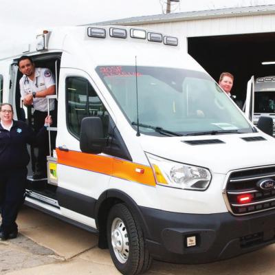 Exploring one of the new ambulances are Sinor employees, from left, Leanne Hileman, Basic; Jeremy Pool, Paramedic; and Michelle Addington, Critical Care Paramedic. CDN | Robert S. Bryan New ambulances delivered to Sinor
