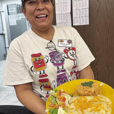 Dolores Torres holds her regional-winning dish, chicken fajita enchiladas, at Nance Elementary. CDN | Courtesy photo Dolores Torres holds her regional-winning dish, chicken fajita enchiladas, at Nance Elementary. CDN | Courtesy photo