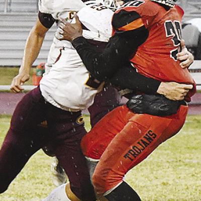 No. 29 Benton Bridgeman takes down the Douglass quarterback, with No. 77 Andre Lime looking to help, during the Red Tornadoes’ regular season-ending victory last week over the Trojans. CDN | John Kinsey Doing everything to win the game
