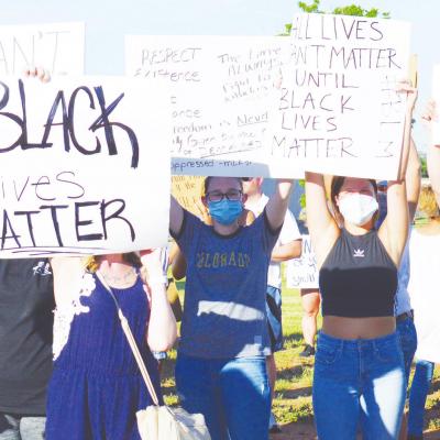 Rainbow of friends, neighbors protested shoulder-to-shoulder