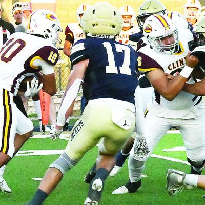 Clinton’s No. 10 JJ Ruiz carries the ball while Andre Lime, right, provides a block for him during the Red Tornadoes’ road game Friday against Kingfisher. CDN | John Kinsey Clinton’s No. 10 JJ Ruiz carries the ball while Andre Lime, right, provides a block for him during the Red Tornadoes’ road game Friday against Kingfisher. CDN | John Kinsey