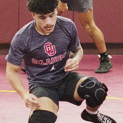 Clinton’s Tristan Cardenas works on his movements during wrestling practice. CDN | Sam Goodwyn